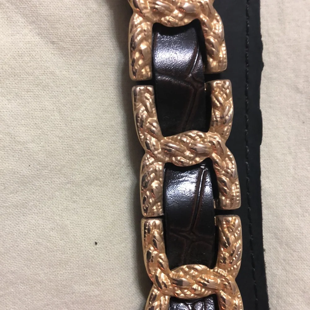Gold and brown belt 35 inches to first hole. Size M